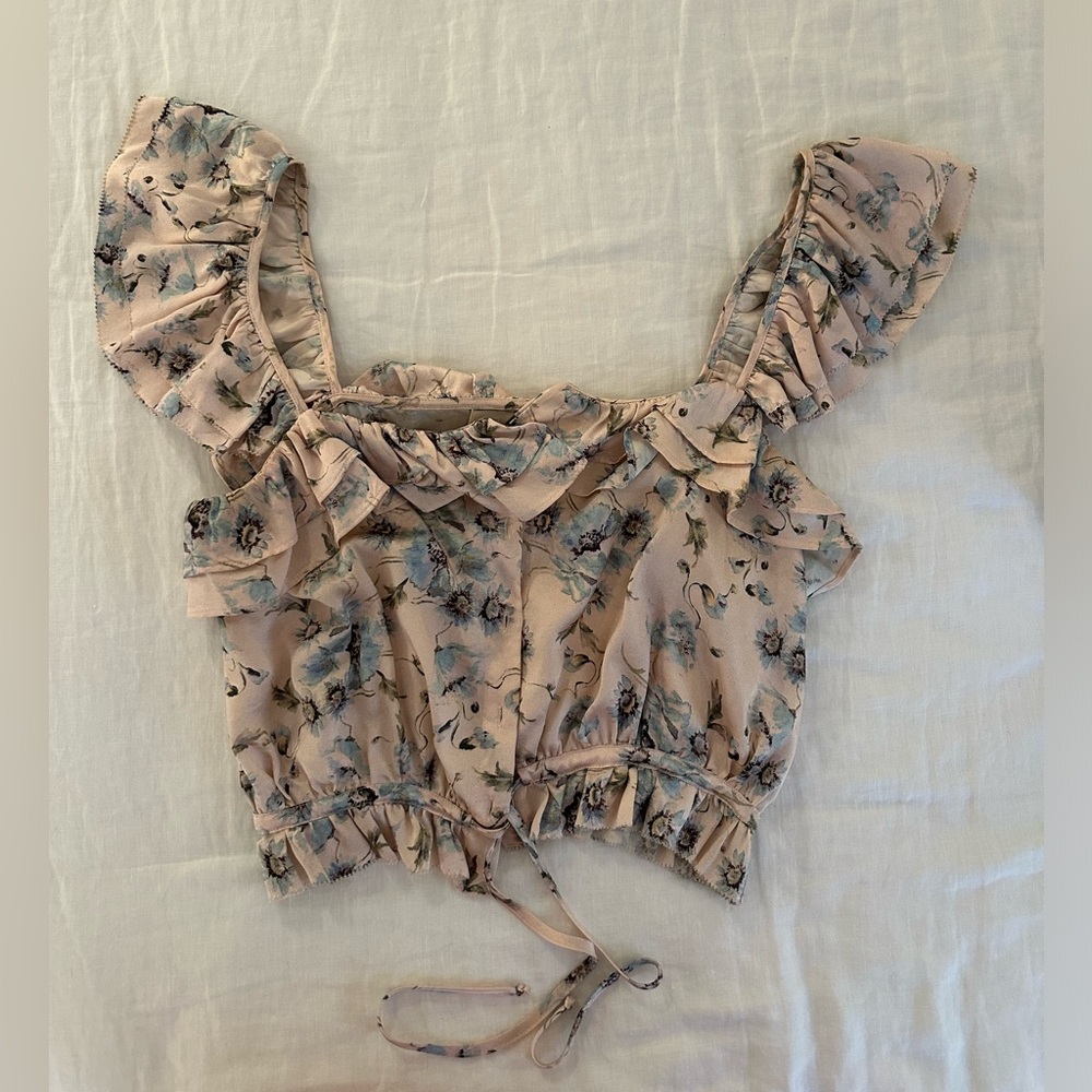 Love Shack Fancy light pink and blue floral top with ruffles